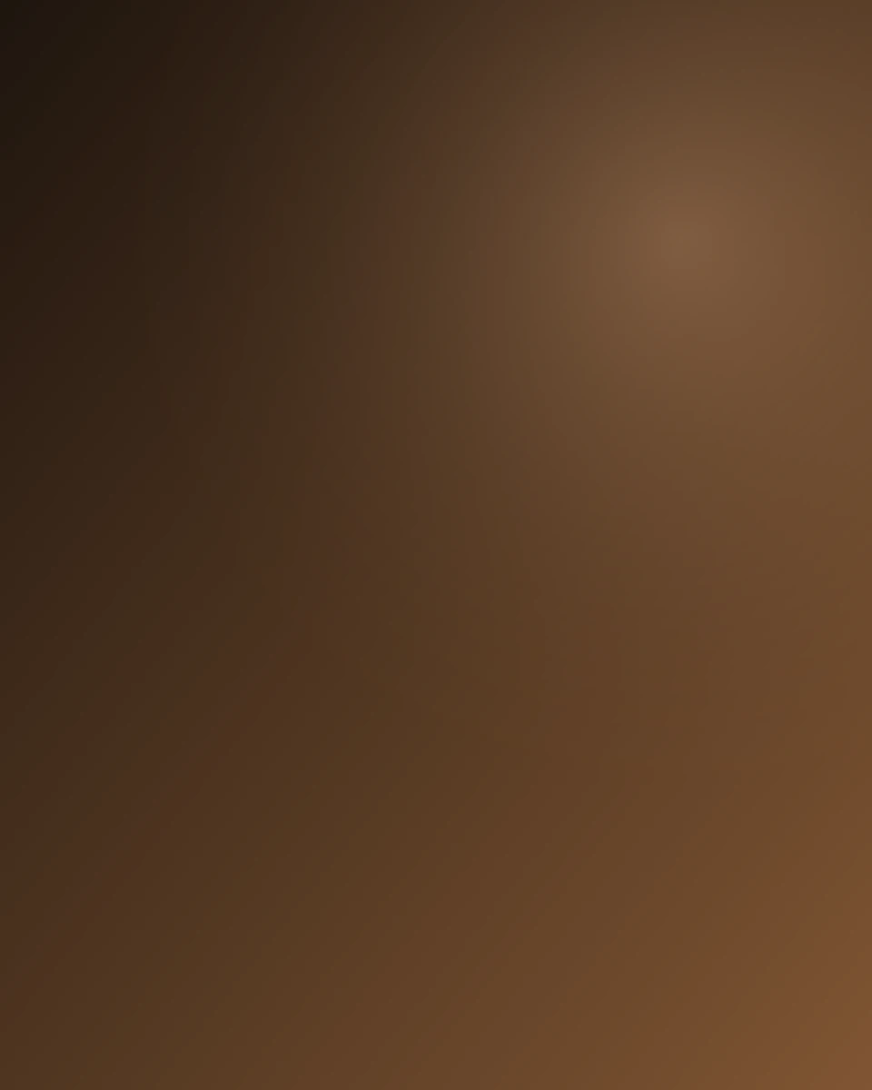 close-up of espresso in a brown ceramic cup on a dark wooden cafe counter, soft morning light from the side, copper coff